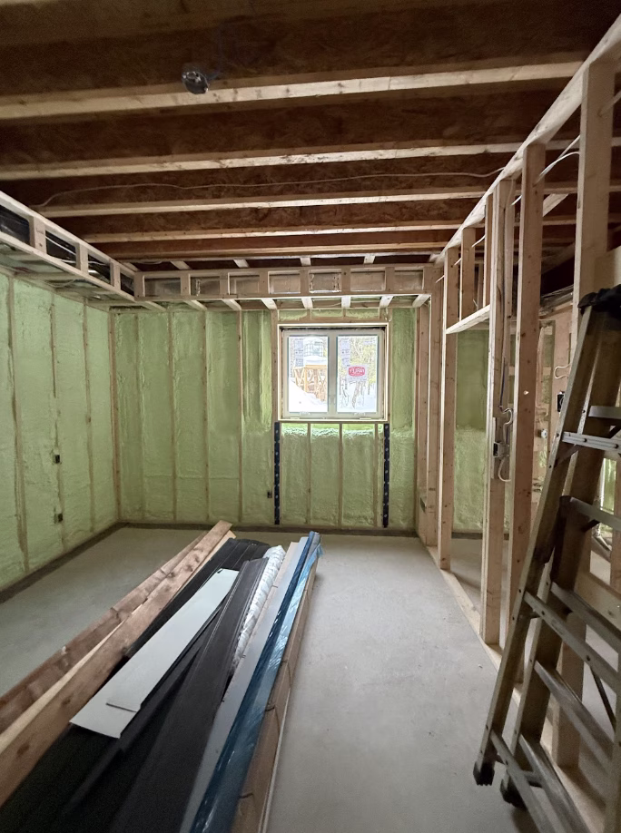 A completed wall insulation project in a home in Peterborough.